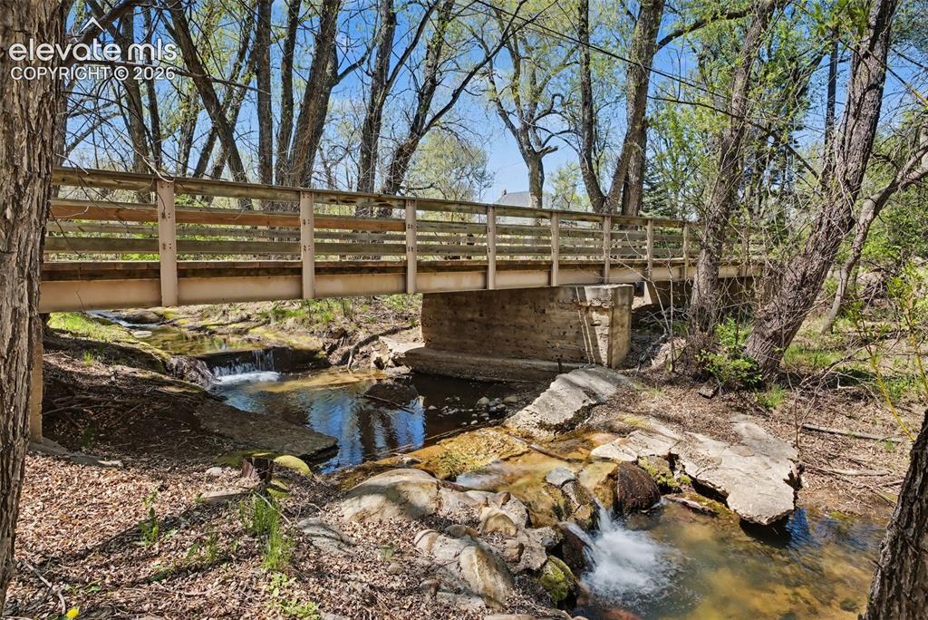 Image 47 of 50: Stream at back of property