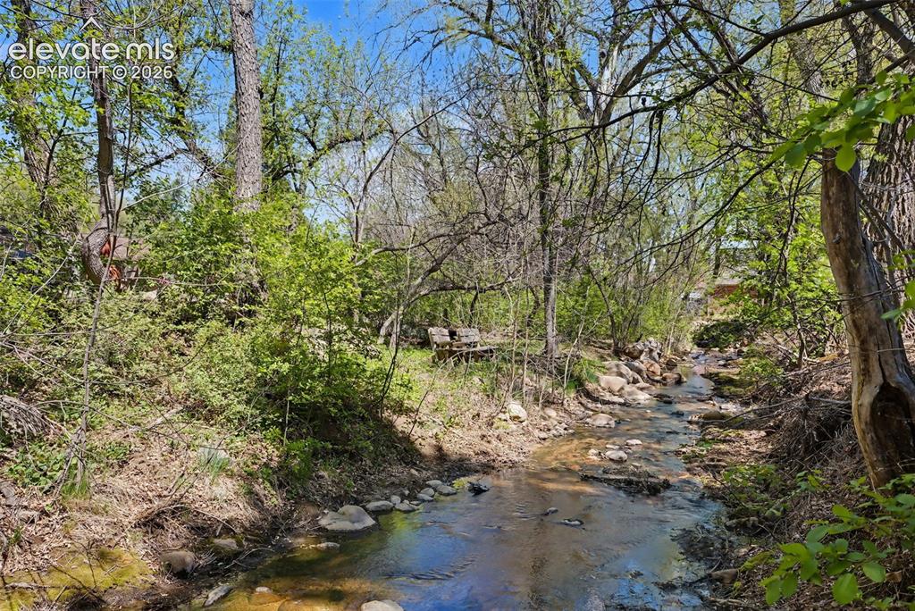Image 49 of 50: Stream at back of property