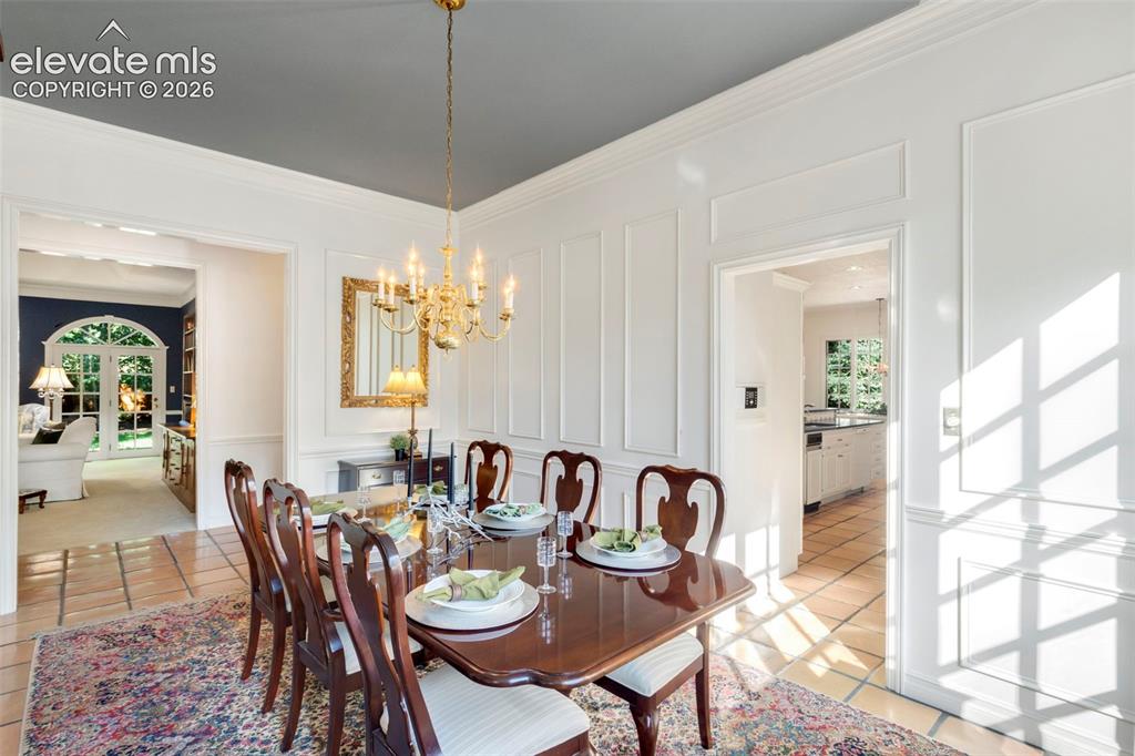 Image 8 of 50: Formal separate dining room open tothe living room and kitchen