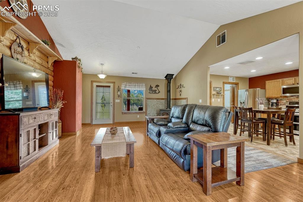 Image 10 of 30: Bright open floorplan flows from living room to kitchen and has 2 walk-out