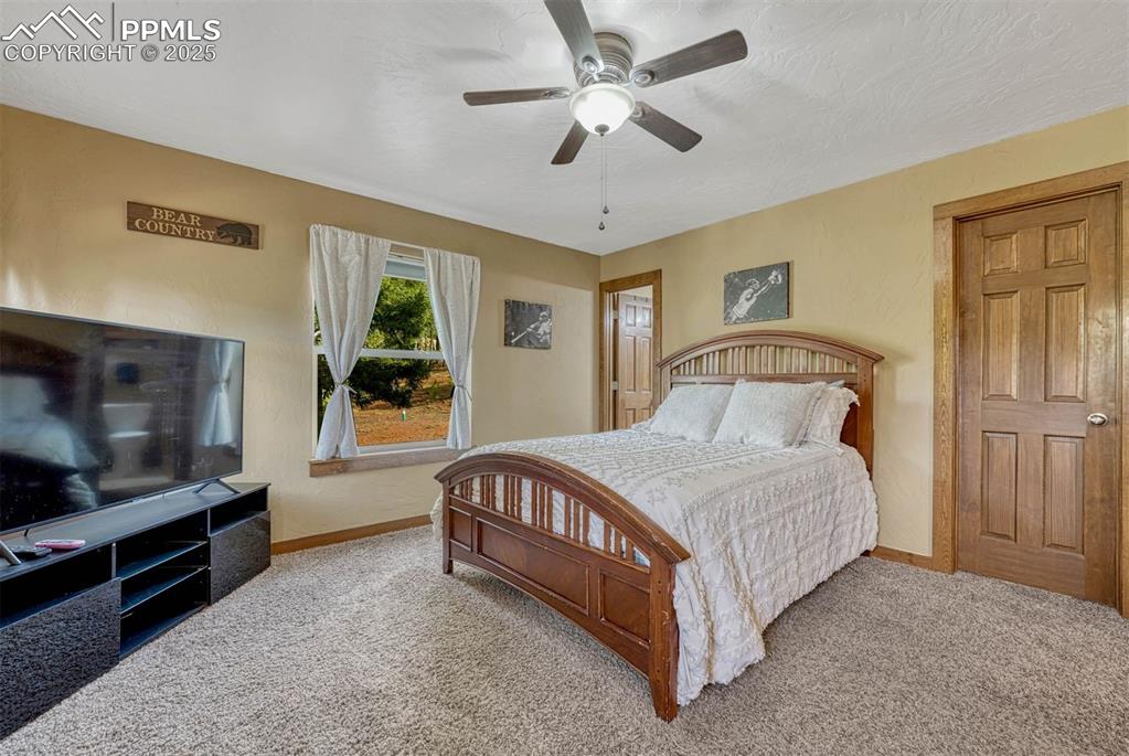 Image 17 of 30: The west facing bedroom is positioned at the northwest corner of the home