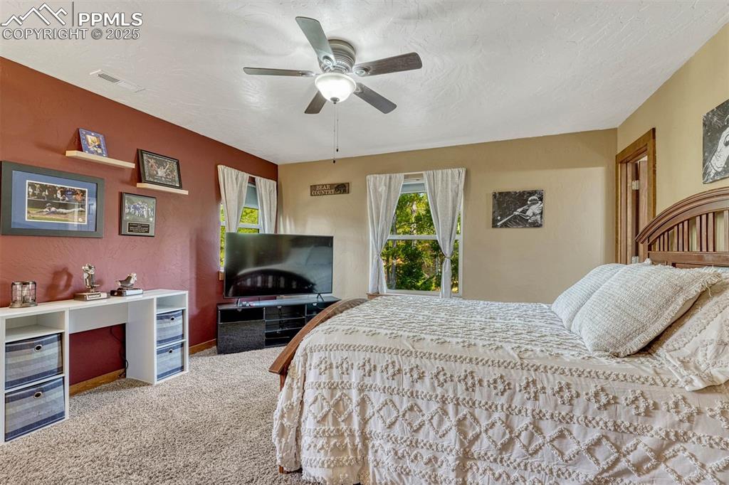 Image 19 of 30: Each bedroom is spacious and has forest views of the property