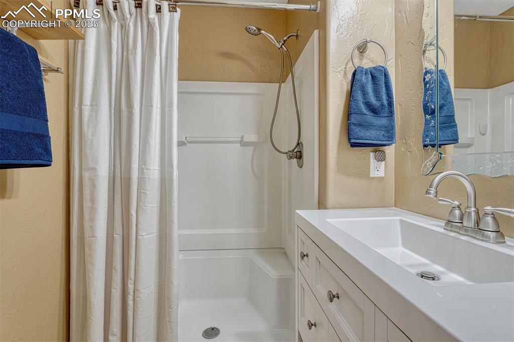 Image 24 of 30: The walk-in shower is great for easy access