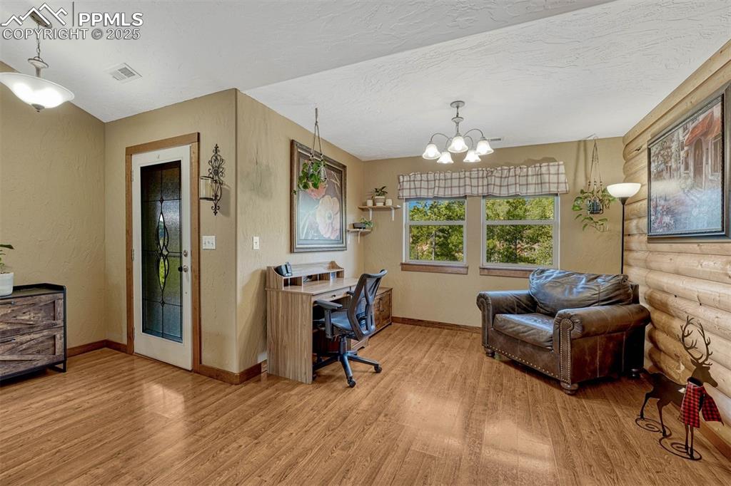 Image 9 of 30: Currently being used as a home office, but this bonus nook can be used any