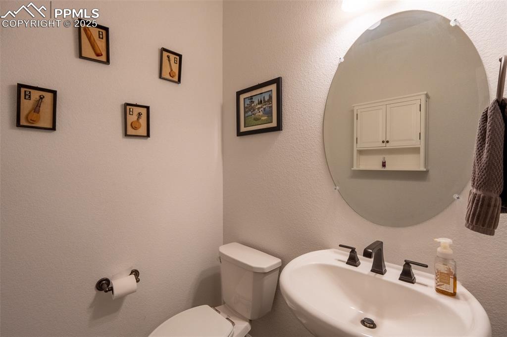 Image 17 of 40: Half bathroom (1) off entrance/foyer - main floor