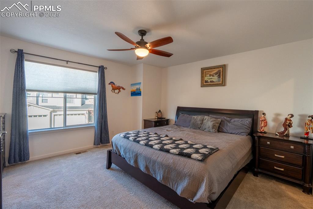 Image 21 of 40: Primary/bedroom (2) with attached primary 3/4 bath with dual sinks - upper