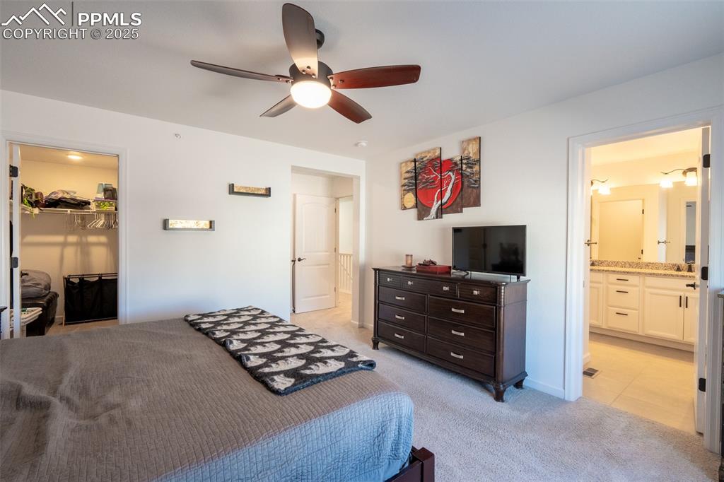 Image 23 of 40: Primary/bedroom (2) with attached primary 3/4 bath with dual sinks - upper