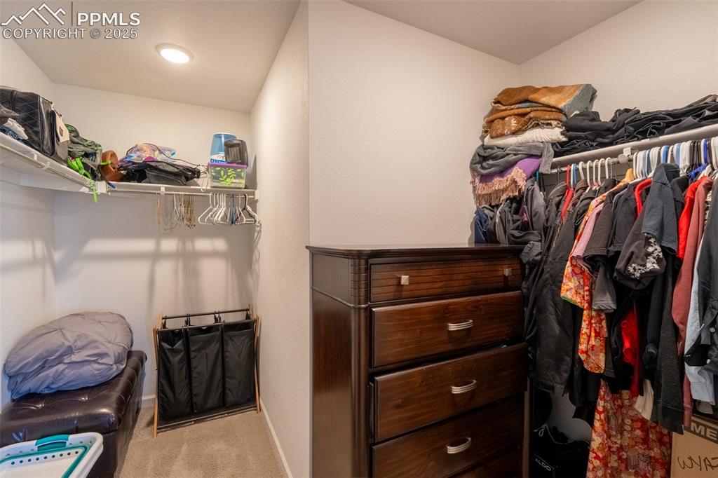 Image 25 of 40: Primary bedroom closet - upper floor