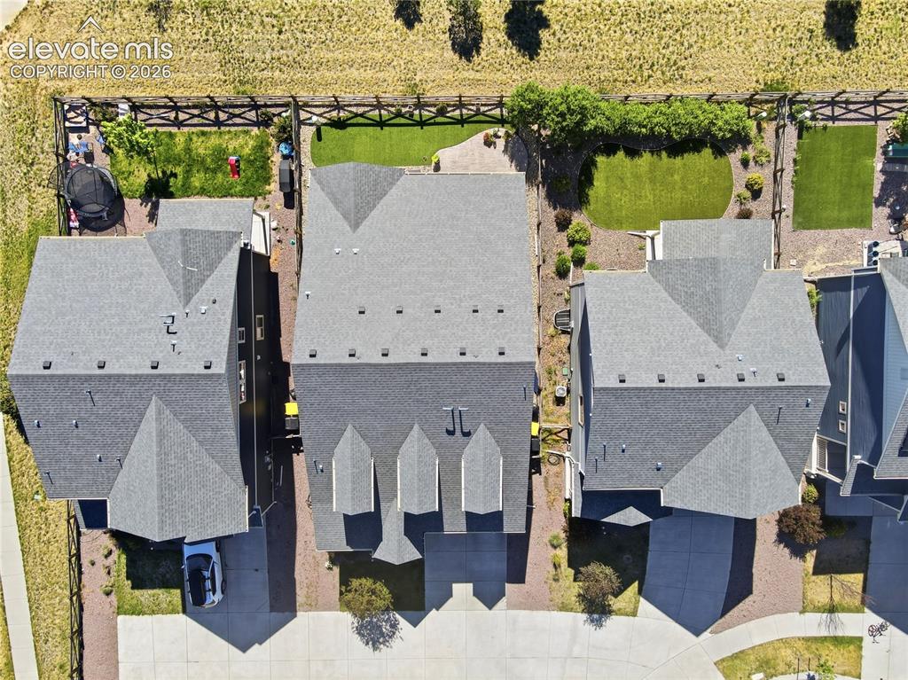 Image 42 of 47: Top-down aerial view of a residential property featuring a gray shingle roo