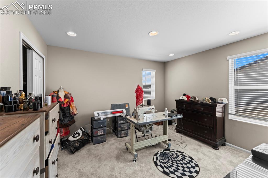 Image 21 of 32: Office area featuring light carpet and recessed lighting