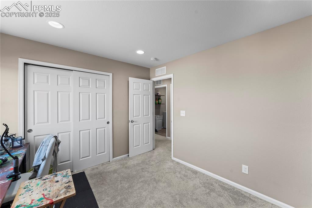 Image 24 of 32: Office area with carpet and recessed lighting