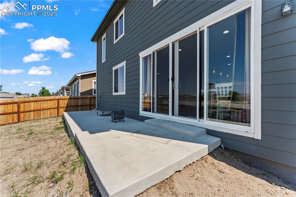 Image 29 of 32: Back of property featuring a patio area