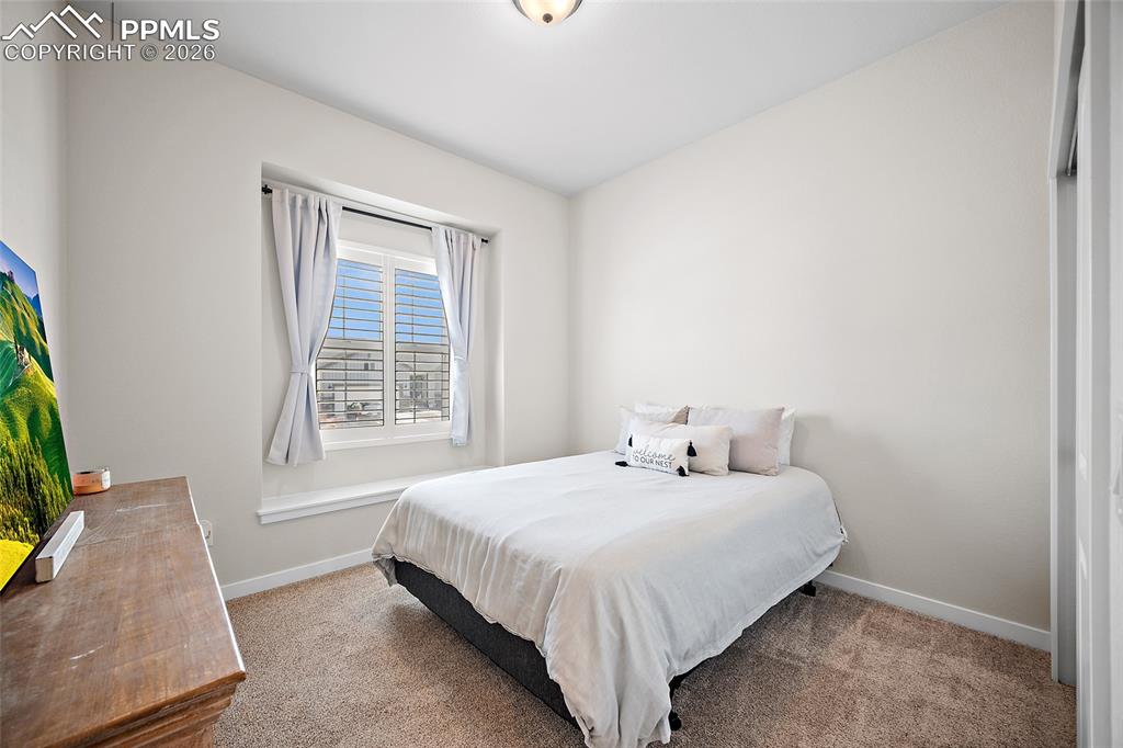 Image 7 of 45: Guest bedroom on main floor