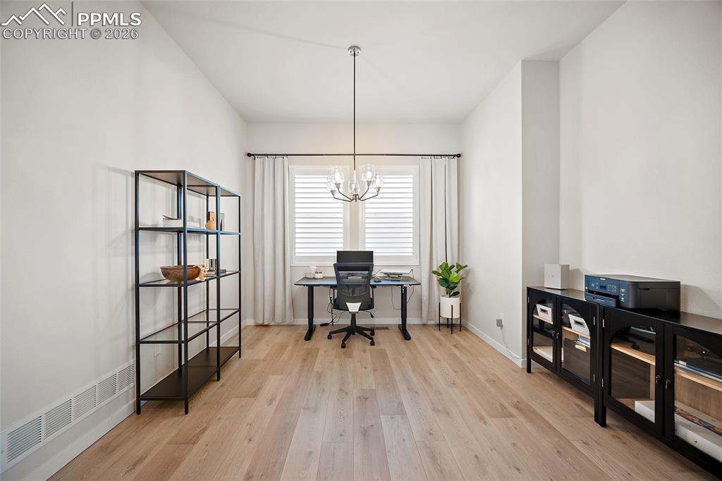 Image 9 of 45: Formal dining used as a home office