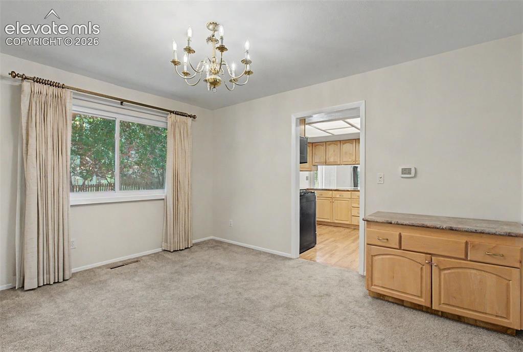 Image 11 of 49: A formal Dining Room area for hosting or for enjoying everyday meals from!