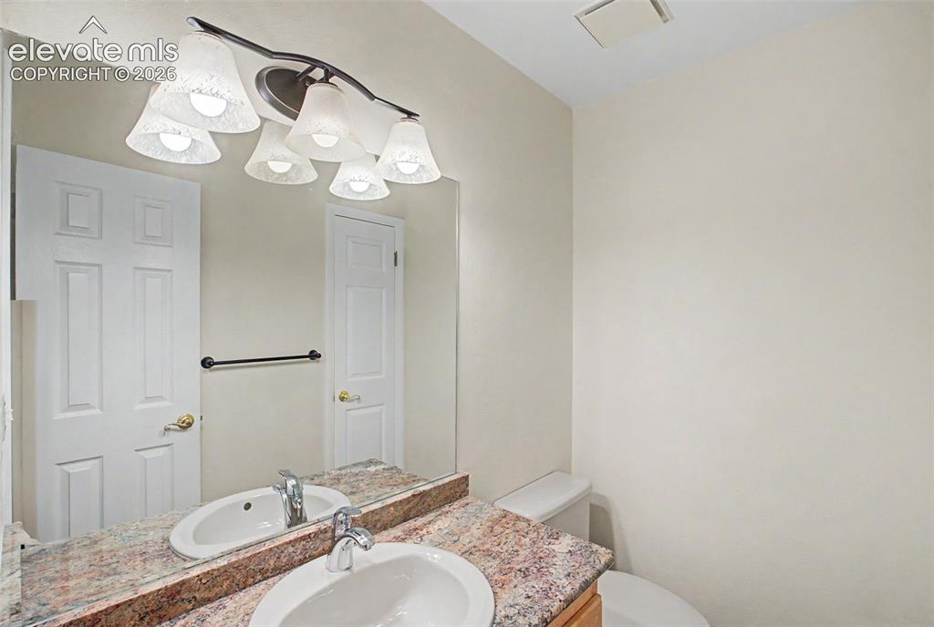 Image 22 of 49: The main level has its own half bathroom!