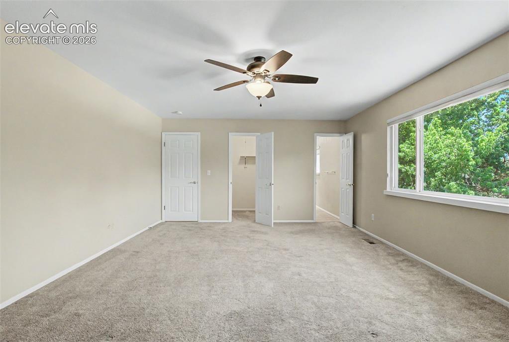 Image 24 of 49: The Primary Bedroom showcases a walk-in closet and an ensuite bathroom!