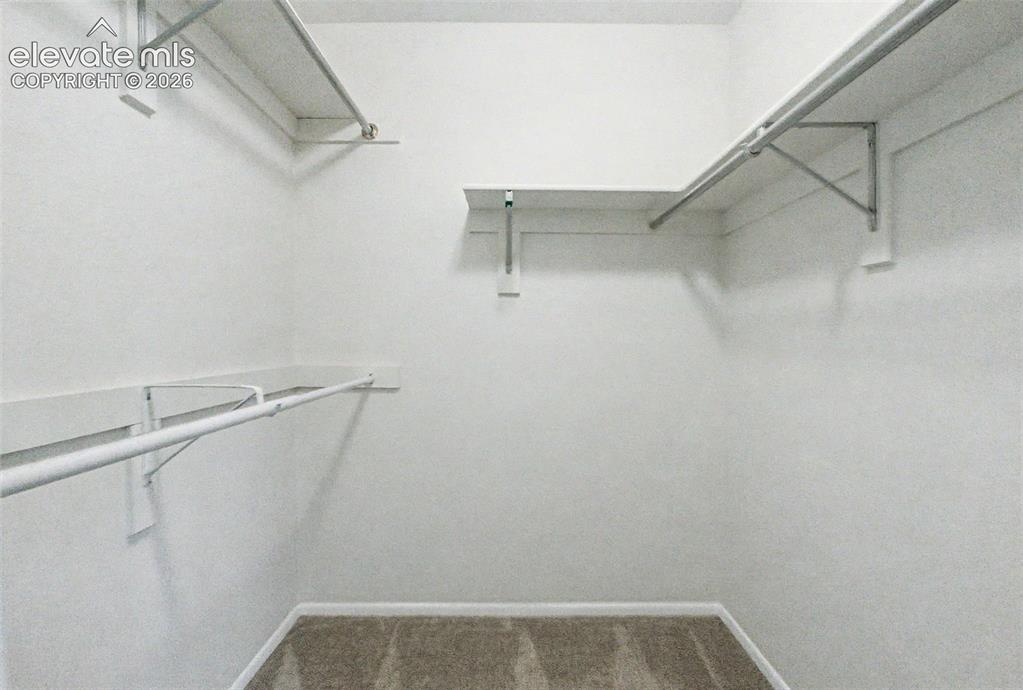 Image 27 of 49: Primary Bedroom Walk-in Closet!