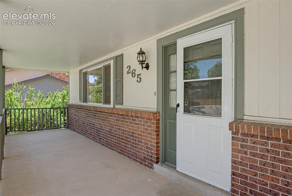 Image 4 of 49: A covered front porch welcomes you inside!