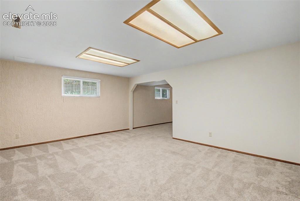 Image 42 of 49: A large, finished carpeted space in the Basement can be utilized as an addi