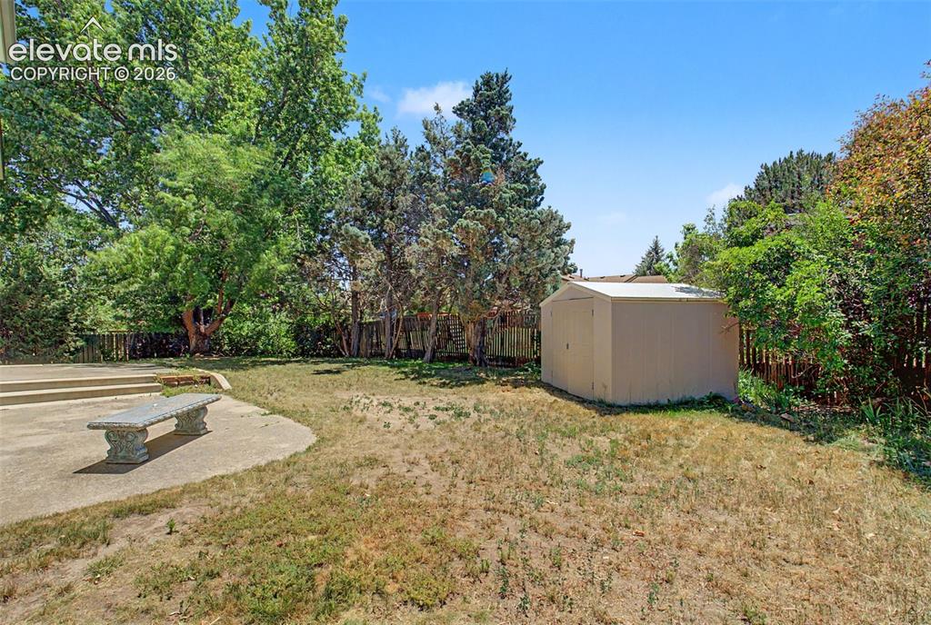 Image 49 of 49: The storage shed, found in the backyard, is included in the purchase of the