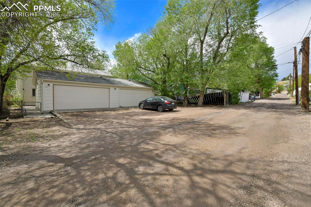 Image 21 of 22: View Of Garages From The Alley