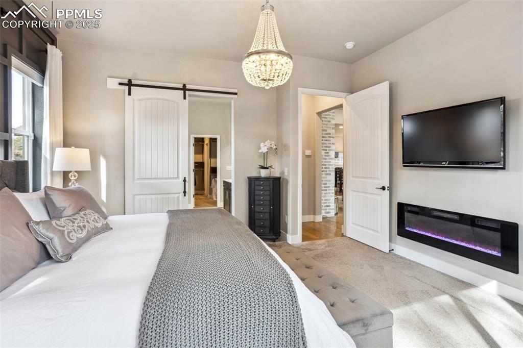 Image 16 of 48: Primary with color changing, warm fireplace