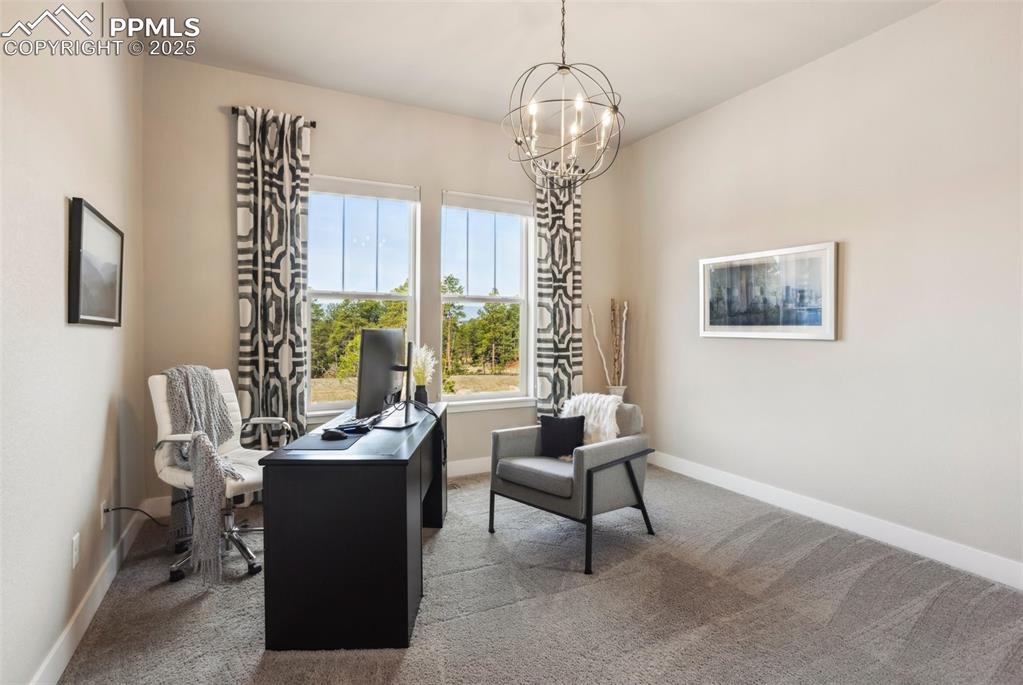 Image 19 of 48: Main level Bedroom with walk in closet enjoys mountain top views!