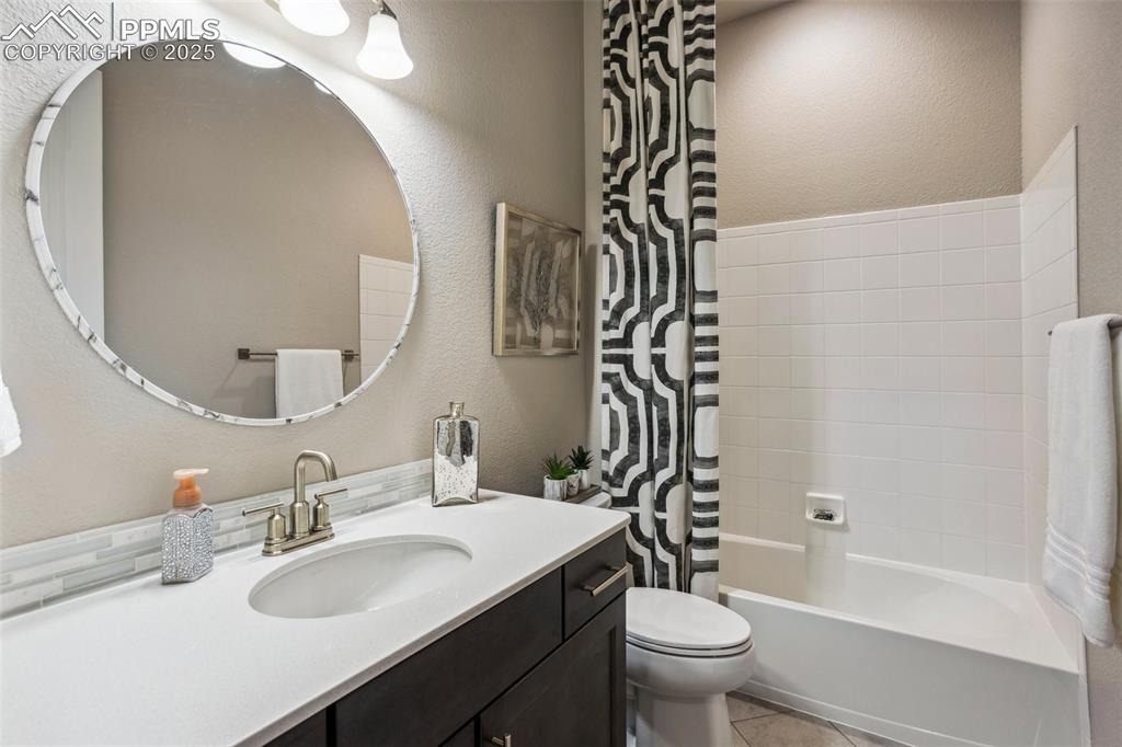 Image 20 of 48: 1st of 5 bathrooms, all with espresso cabinetry and quartz counters!