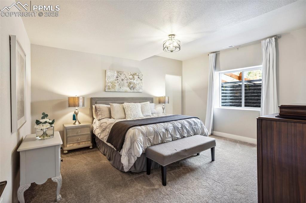 Image 25 of 48: Secondary primary suite with private en-suite bath and walk in closet