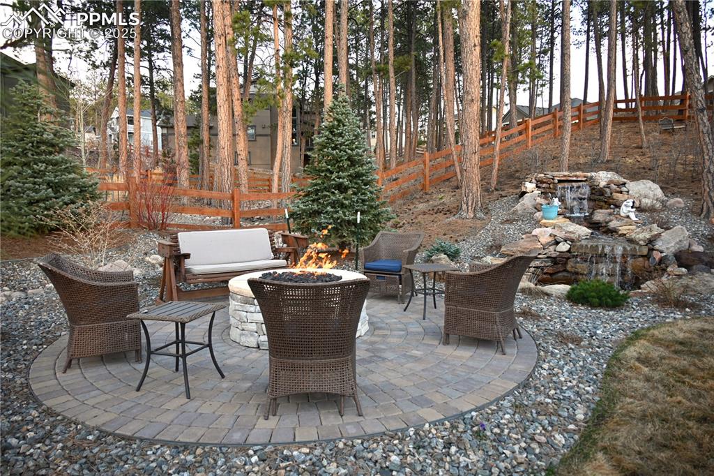Image 40 of 48: Gather around the Gas Firepit to sounds of waterfall