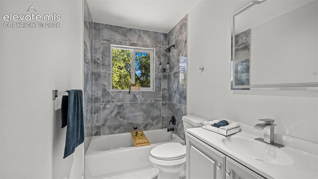 Image 22 of 44: New tile in all bathrooms