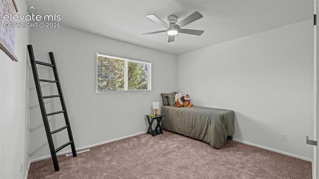 Image 23 of 44: Recessed window, modern ceiling fan, and light-toned wall finishes