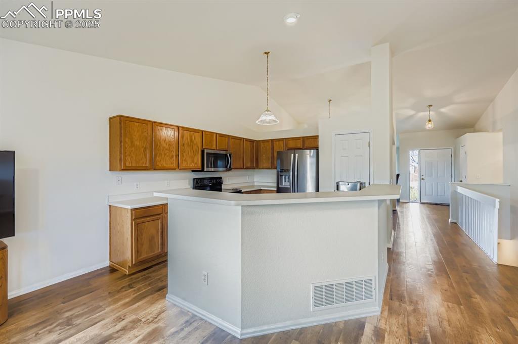 Image 10 of 29: Kitchen with oak cabinets, light countertops, stainless steel appliances, d