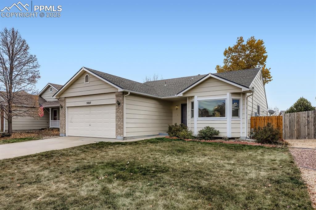 Image 3 of 29: Ranch-style home featuring driveway, an attached garage, a shingled roof, a