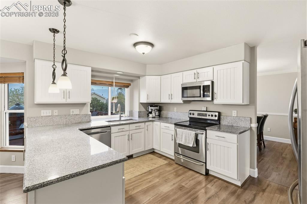 Image 4 of 35: Updated kitchen with views of of the twinkling lights