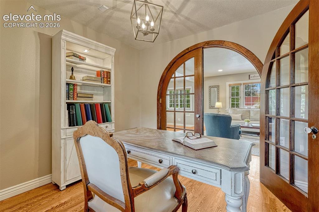 Image 11 of 50: Main Level Office or Bedroom with custom doors.
