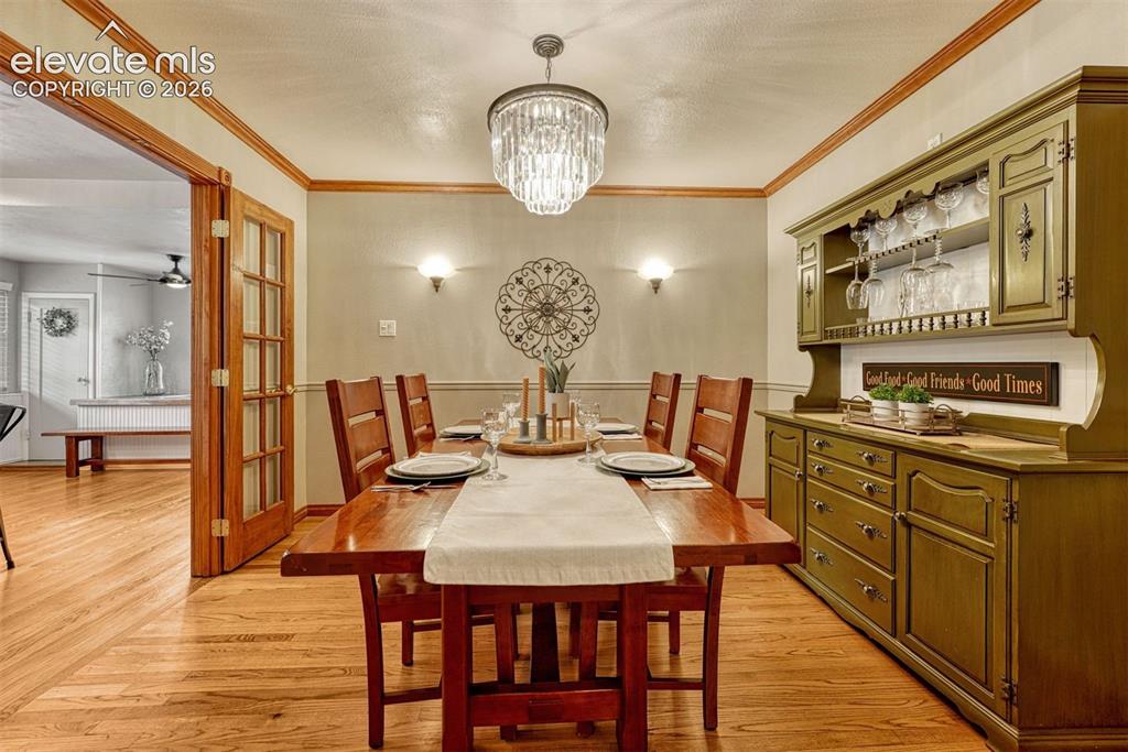 Image 13 of 50: Dining Room with French Doors to kitchen.