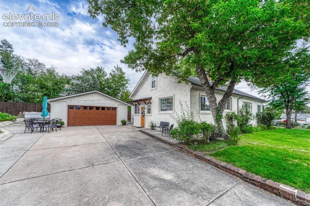 Image 35 of 50: Two-Car Detached Garage with huge driveway.