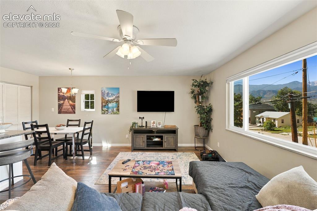 Image 10 of 50: Upper level living room and large picture window.