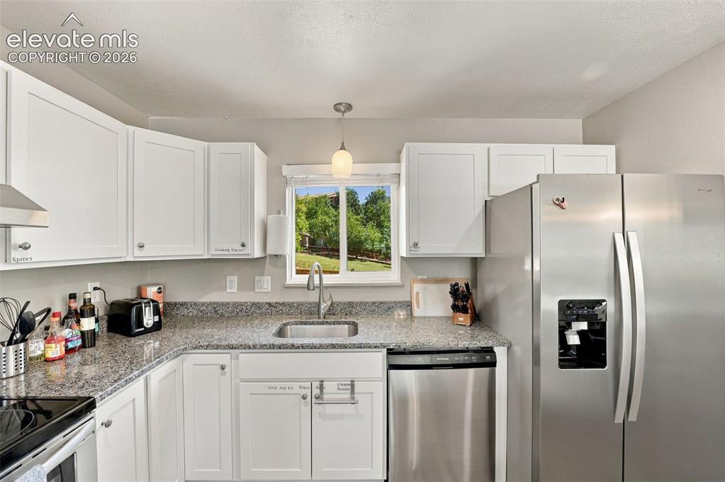 Image 13 of 50: So much natural light throughout the kitchen!