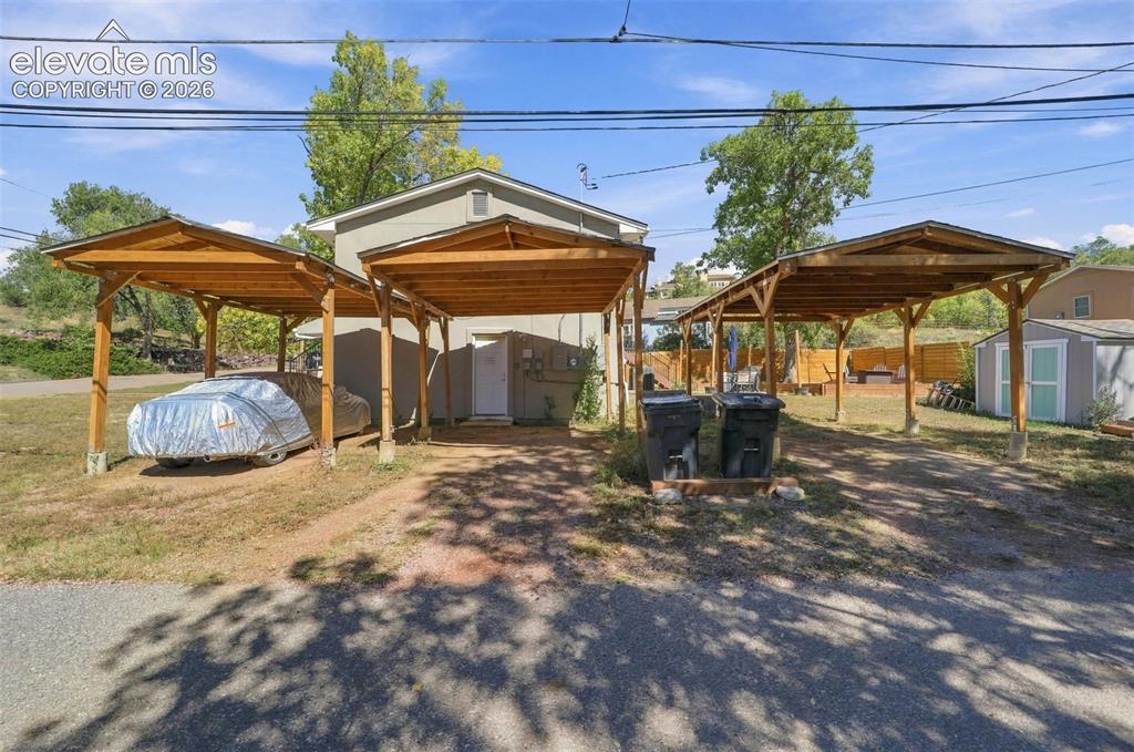 Image 44 of 50: The property has  3 separate carports for  parking!