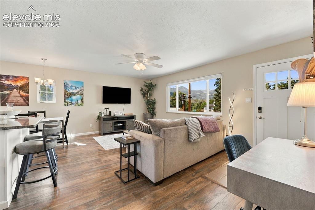 Image 8 of 50: Enjoy the great room feel with updated hardwood flooring!