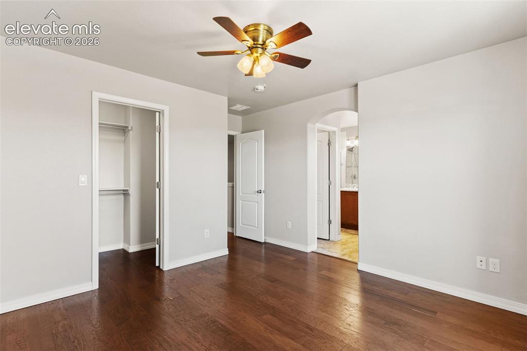 Image 17 of 29: Walk in closet in primary bedroom