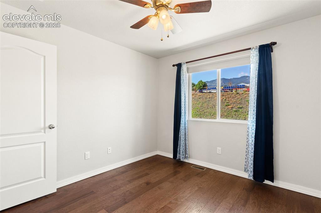 Image 20 of 29: 2nd bedroom with mountain views!
