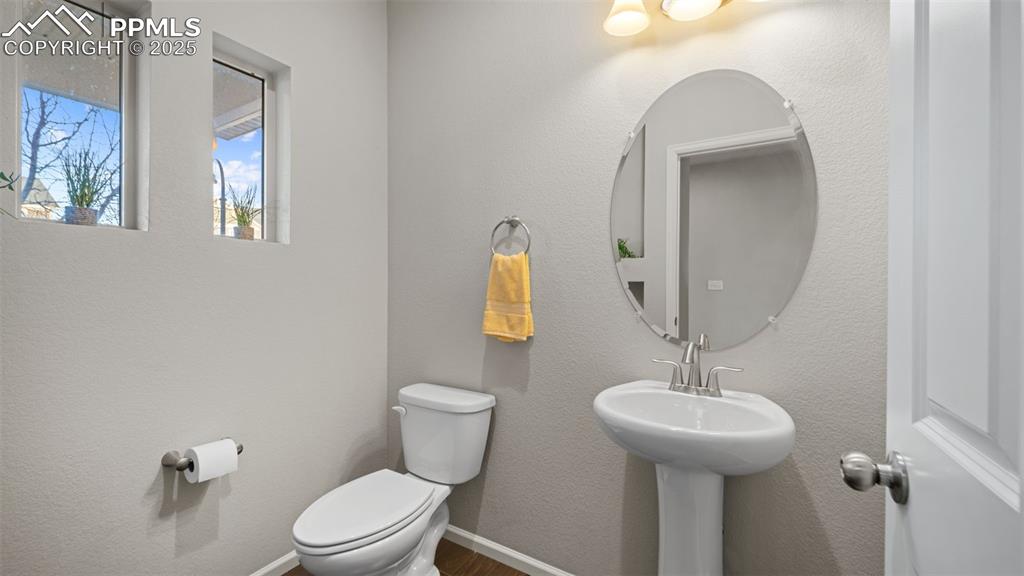 Image 22 of 48: Half bathroom with floors