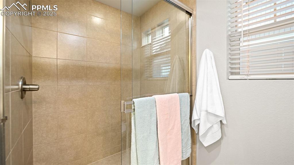 Image 30 of 48: Full bathroom with a stall shower