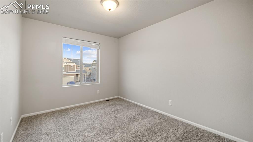 Image 33 of 48: Secondary bedroom with baseboards