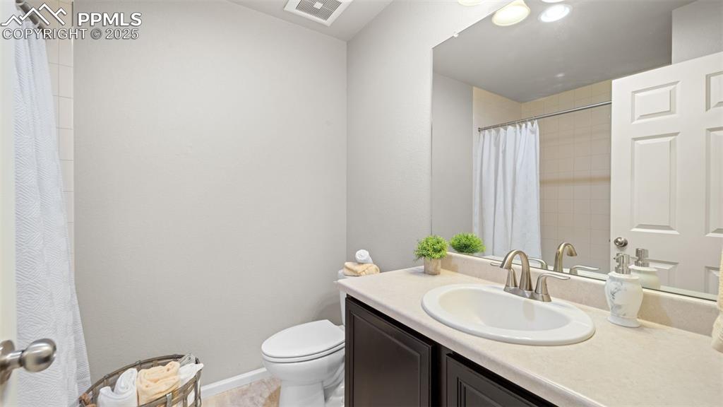Image 34 of 48: Bathroom with vanity and a shower/tub with ceramic tile surround