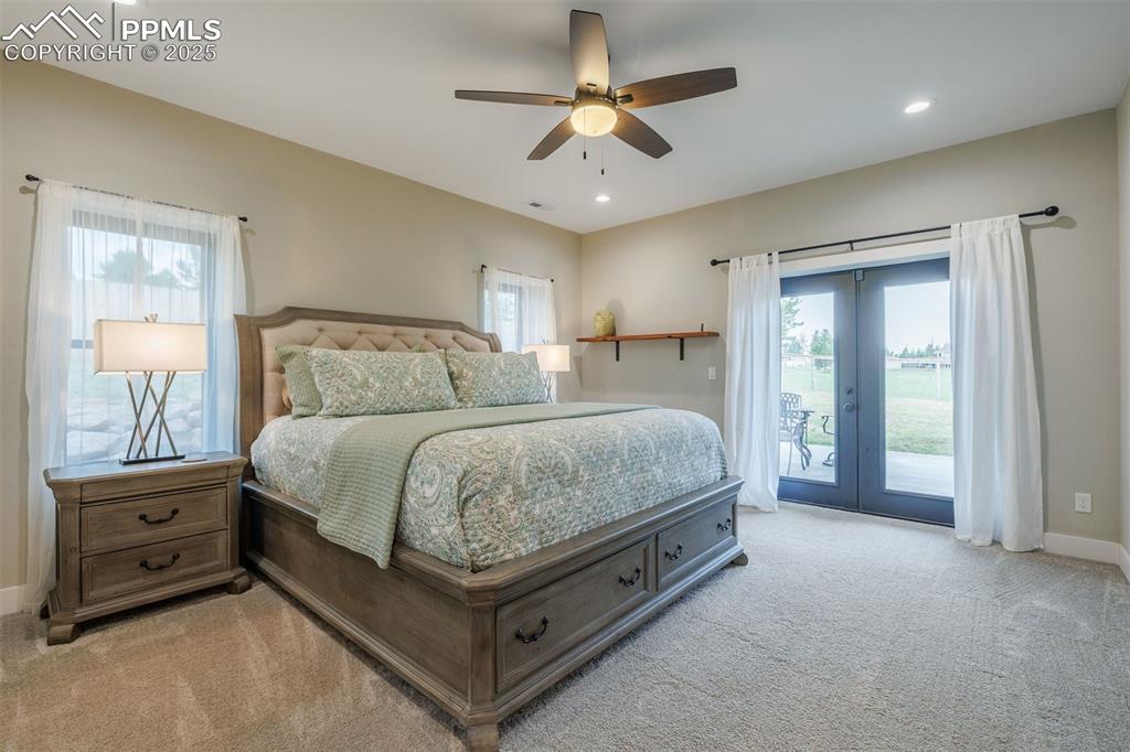 Image 20 of 38: Bedroom with access to outside, light carpet, recessed lighting, and a ceil